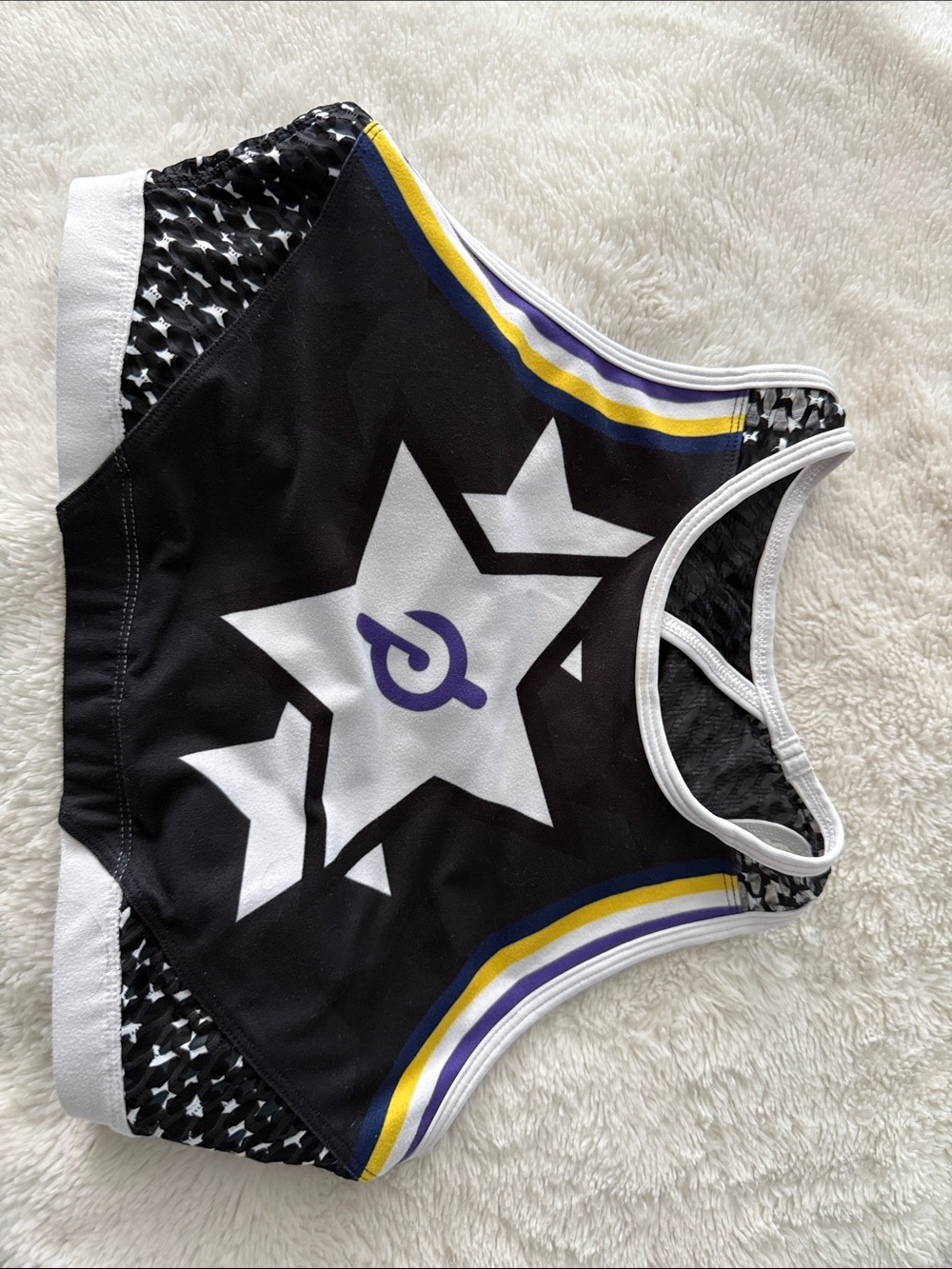 Peloton With Black Star Print Athletic Crop Top with Purple & Yellow Accents Med